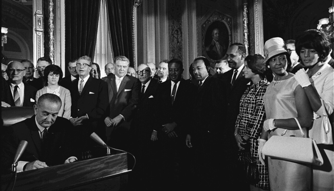 President Lyndon B. Johnson signs the Voting Rights Act of 1965