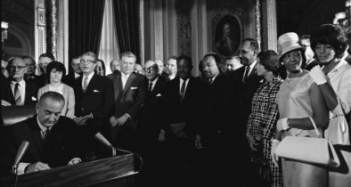 President Lyndon B. Johnson signs the Voting Rights Act of 1965
