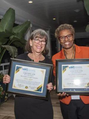 Volunteer chairs Clara Licata and Sandy Baynard are recognized for their contributions to SDARJ.