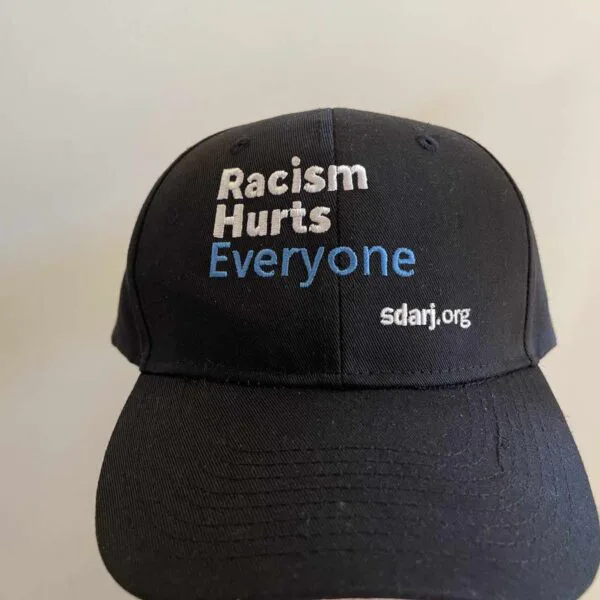 Racism Hurts Everyone – Cap